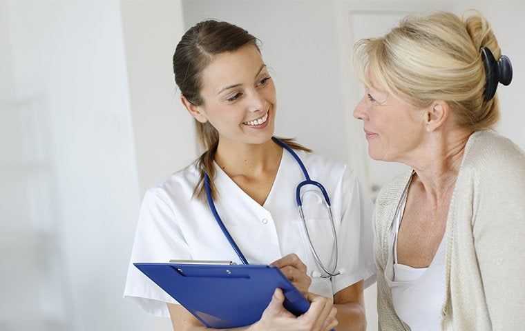 A nurse communicating with a patient